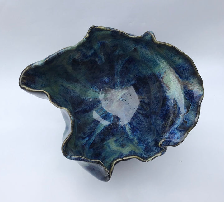 Sculptured flowing blue vessel