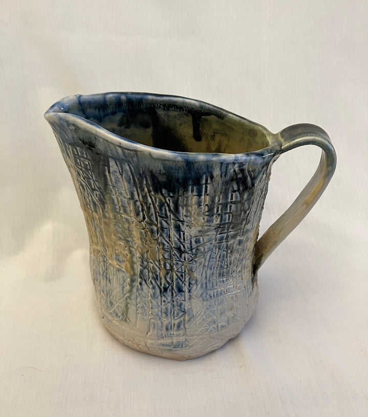 Textured ceramic pitcher